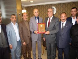 Korkut'a başarı plaketi